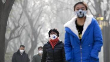 Chinese people wearing masks for protection against pollution