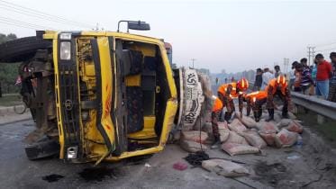 truck overturns in Tangail