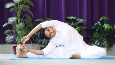 Tired of sucking in your belly? Try these yoga moves to shrink it for real