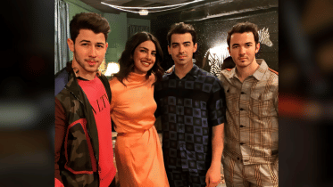 Priyanka Chopra and Nick Jonas with Jonas Brothers