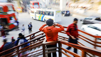 Person overwhelmed with the sound around him.