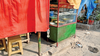 Tong veiled behind a red curtain.