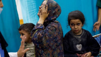 Message to the West on Christmas: Remember humanity A woman reacts while sitting with Palestinian children wounded in Israeli strikes waiting to receive treatment at Nasser Hospital in Khan Younis in the southern Gaza Strip, Nov. 12, 2023.