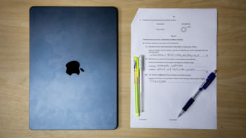 A laptop and a Chemistry question paper