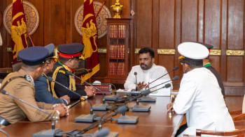Newly-elected Sri Lankan President Anura Kumara Dissanayake speaks with the military and police chiefs after being sworn in at the Presidential Secretariat, in Colombo, Sri Lanka on September 23, 2024. SOURCE: REUTERS