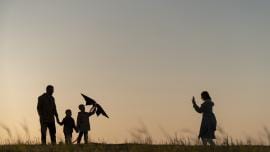 family-silhouettes-having-fun-sunset-full-shot.jpg