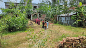 People gather in front of the family’s house as shock grips the area, leaving a heavy silence over the community after the news broke. Photo: Star