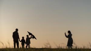 family-silhouettes-having-fun-sunset-full-shot.jpg