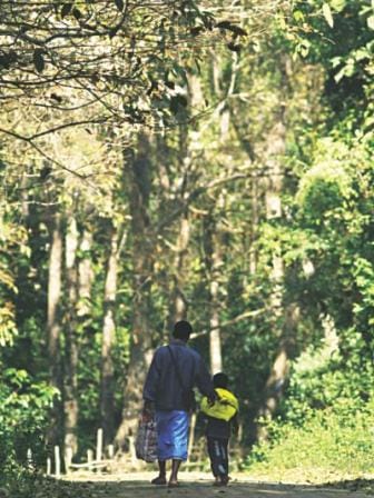 Father and son walk home from school