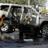 a vehicle damaged by a suicide bomb  a vehicle damaged by a suicide bomb