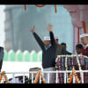 Aam Aadmi Party (AAP) president Arvind Kejriwal (C) greets his supporters as fellow Minister Manish Sisodia (R) looks on during his swearing-in ceremony as Delhi chief minister in New Delhi on February 14, 2015. Photo: AFP