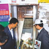 People gather around a collapsed lift People gather around a collapsed lift