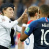 Pitch invader and France's Kylian Mbappe Pitch invader and France's Kylian Mbappe