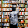 Browsing the shelves at a bookshop Browsing the shelves at a bookshop