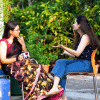 Two sisters having a conversation.