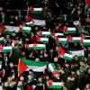 Celtic fans hold up Palestinian flags Celtic fans hold up Palestinian flags