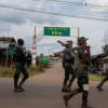 Volunteer members of Karenni insurgent forces walk in Moe Bye in Kayah State, Myanmar Volunteer members of Karenni insurgent forces walk in Moe Bye in Kayah State, Myanmar