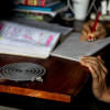 Student in their dorm room with a mosquito repellent coil burning.