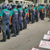 Cops look away as protesters write anti-govt slogans Cops look away as protesters write anti-govt slogans