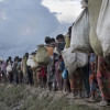 Rohingya refugees walk after crossing the Naf river from Myanmar into Bangladesh in Whaikhyang. File Photo: AFP