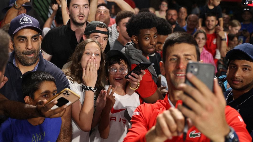 Djokovic poses for a selfie with fans after winning the Adelaide International against Sebastian Korda of the U.S.