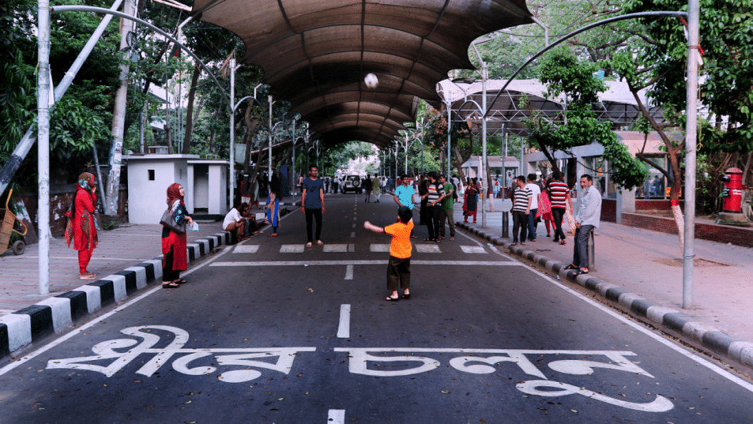 People spending time at a public space in Dhanmondi