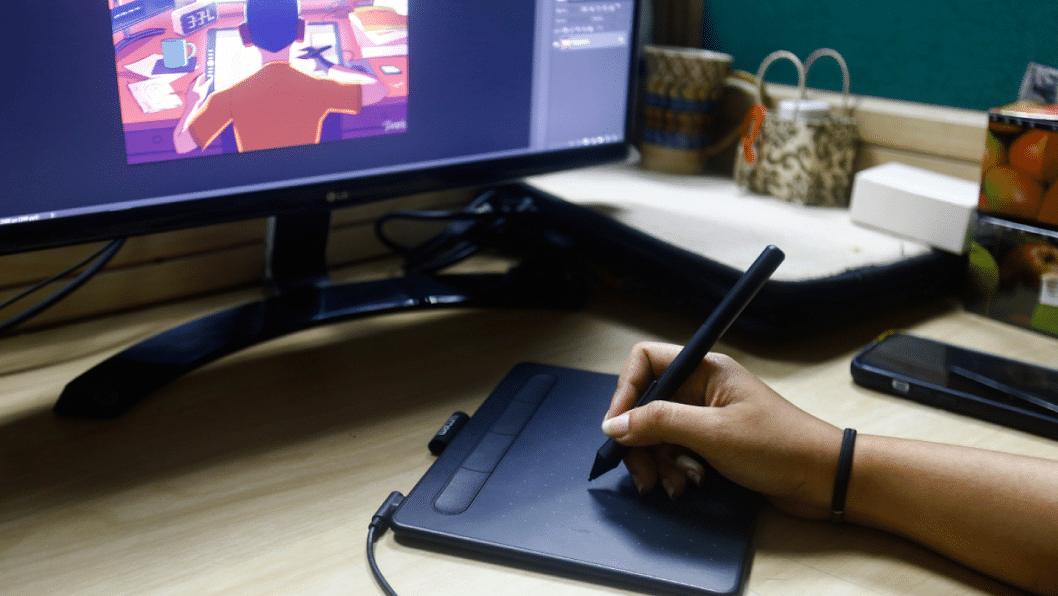 Artist drawing on a graphic tablet