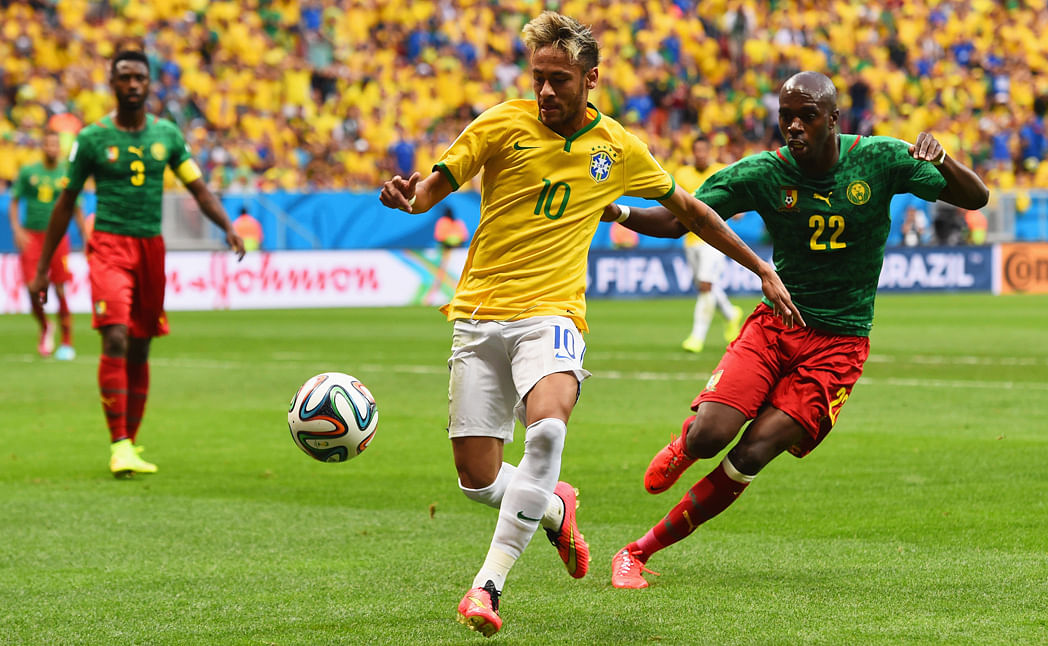 Neymar of Brazil controls the ball against Allan Nyom of Cameroon during their Group A match on June 23, 2014 in Brasilia, Brazil.  Photo: Getty Images