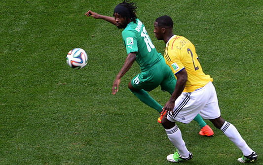 Ivory Coast's forward Gervinho (L) fights for the ball with Colombia's defender Cristian Zapata during a Group C football match between Colombia and Ivory Coast at the Mane Garrincha National Stadium in Brasilia during the 2014 FIFA World Cup on June 19, 2014. Photo: Getty Images