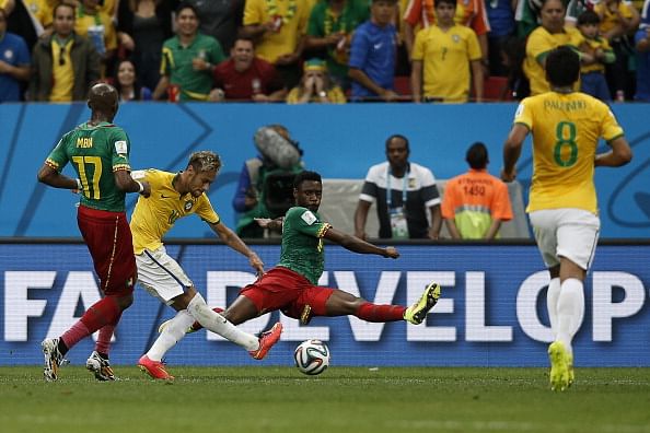 Brazil's forward Neymar celebrates after scoring a goal during the Group A football match between Cameroon and Brazil at the Mane Garrincha National Stadium in Brasilia during the 2014 FIFA World Cup on June 23, 2014. Photo: Getty Images