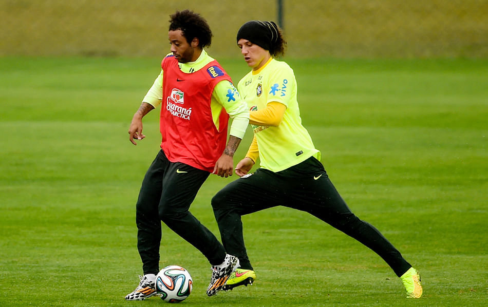 3.	Marcelo (L) and David Luiz take part in a training session of the Brazilian national football team at the squad's Granja Comary training complex, on July 11, 2014. Photo: Getty Images