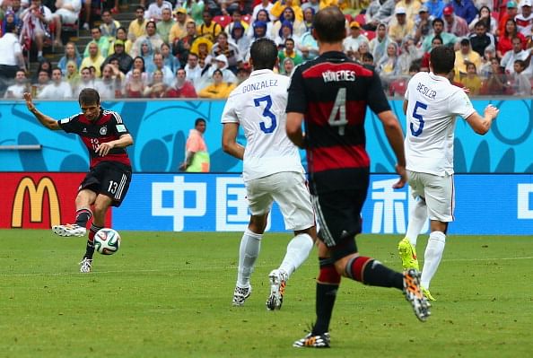 Clint Dempsey of the United States is challenged by Jerome Boateng (L) and Mats Hummels of Germany during the 2014 FIFA World Cup Brazil group G match between the United States and Germany at Arena Pernambuco on June 26, 2014 in Recife, Brazil. Photo: Getty Images