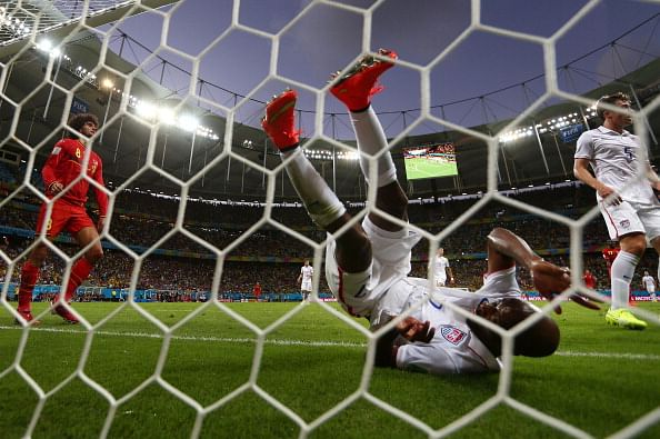 DaMarcus Beasley of the United States falls into the net after clearing the ball off the line during the 2014 FIFA World Cup Brazil Round of 16 match between Belgium and the United States at Arena Fonte Nova on July 1, 2014 in Salvador, Brazil. Photo: Getty Images