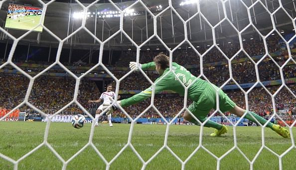 Netherlands' goalkeeper Tim Krul (R) fails to make a save from Costa Rica's midfielder Celso Borges during a penalty shoot-out after extra-time during a quarter-final football match between Netherlands and Costa Rica at the Fonte Nova Arena in Salvador during the 2014 FIFA World Cup on July 5, 2014. Photo: Getty Images