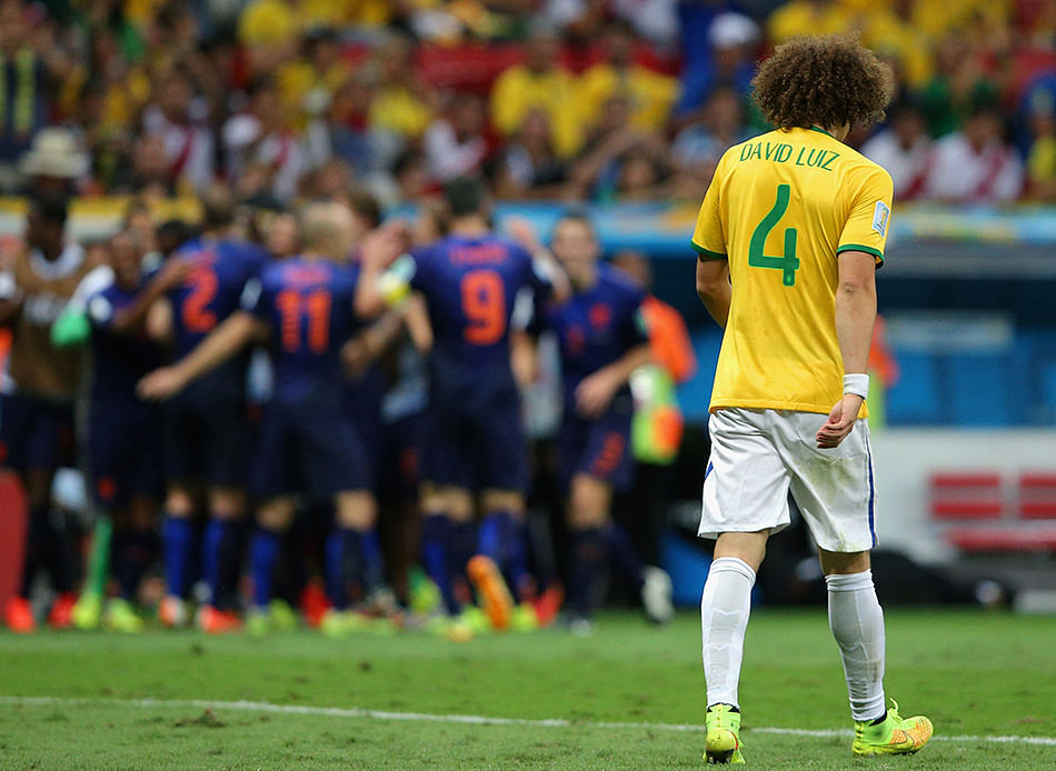 A dejected David Luiz of Brazil walks off the pitch after a 3-0 defeat to the Netherlands during the 2014 FIFA World Cup Brazil Third Place Playoff match between Brazil and the Netherlands at Estadio Nacional on July 12, 2014 in Brasilia, Brazil. Photo: Getty Images
