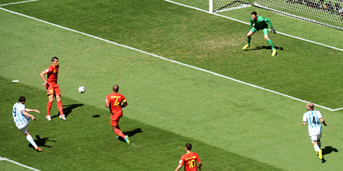 Argentina's forward Gonzalo Higuain (L) shoots to score during a quarter-final football match between Argentina and Belgium at the Mane Garrincha National Stadium in Brasilia during the 2014 FIFA World Cup on July 5, 2014. Photo: Getty Images