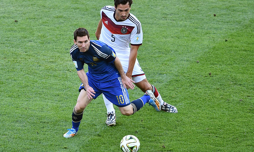 Germany's defender Mats Hummels (back) follows Argentina's forward and captain Lionel Messi during their 2014 FIFA World Cup final match at the Maracana Stadium in Rio de Janeiro on July 13, 2014. Photo: Getty Images