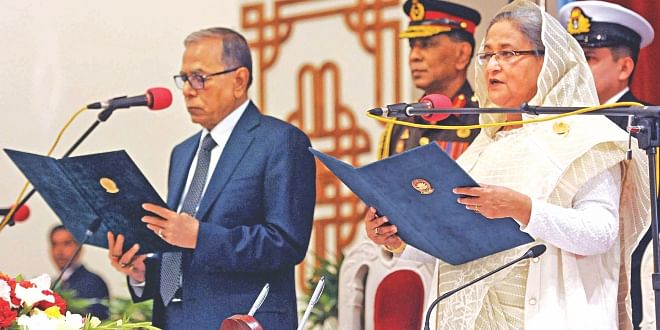 President Abdul Hamid swears in Sheikh Hasina as prime minister at the Darbar Hall of Bangabhaban yesterday. Photo: PID