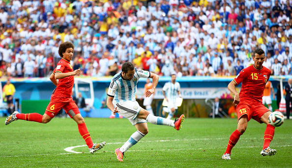 Gonzalo Higuain of Argentina shoots and hits the cross bar as Axel Witsel (L) and Daniel Van Buyten of Belgium defend during their World Cup quarter-final match at the Mane Garrincha National Stadium in Brasilia on July 5, 2014. Photo: Getty Images