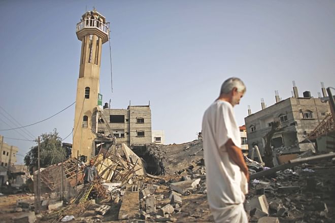 A Palestinian man inspects the rubble of a destroyed mosque following an Israeli military strike in the Nusseirat refugee camp in the central Gaza Strip. Photo:AFP