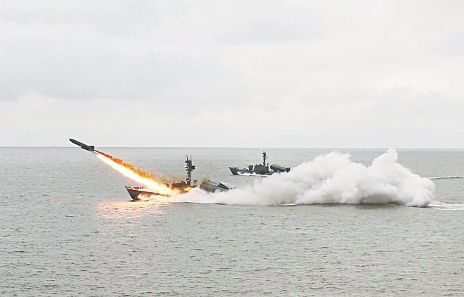 A ship fires missile during an annual exercise of Bangladesh Navy in the Bay of Bengal yesterday.  Photo: Anurup Kanti Das 