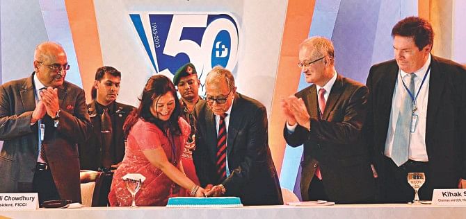 President Abdul Hamid and Foreign Investors' Chamber of Commerce and Industry President Rupali Chowdhury cut a cake to mark the association's 50th founding anniversary at Hotel Sonargaon in Dhaka yesterday. Photo: PID