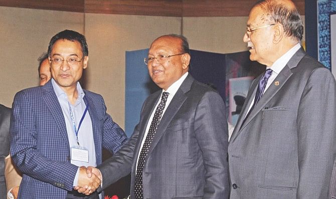Abdullah Al-Mahmud, MD of Hamid Weaving Mills Ltd, receives the CIP card for 2012 from Commerce Minister Tofail Ahmed at a function at Radisson Hotel in Dhaka yesterday. Abdullah Al-Mahmud was awarded in textile (fabrics) category. Photo: Star