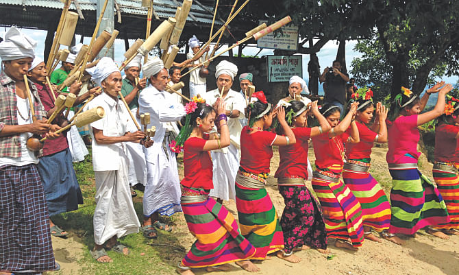 A cultural programme of Mro community at Cramadipara of Thanchi in Bandarban. Their culture and livelihood have increasingly come under threat with their farmland and ancestral homes being taken over. The photo was shot recently.    Photo: Pinaki Roy