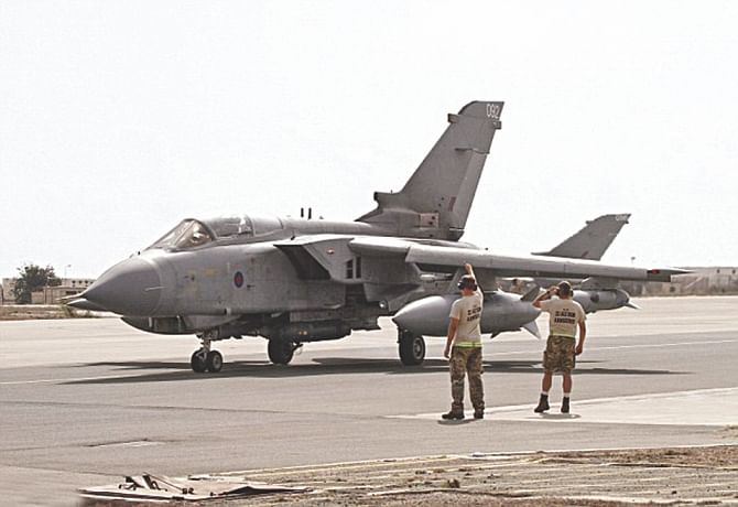 Two Royal Air Force Tornado GR4 aircraft prepare to depart Cyprus base, armed with Paveway IV laser guided bombs, in support of Operation Shader, yesterday. Photo: Daily Mail
