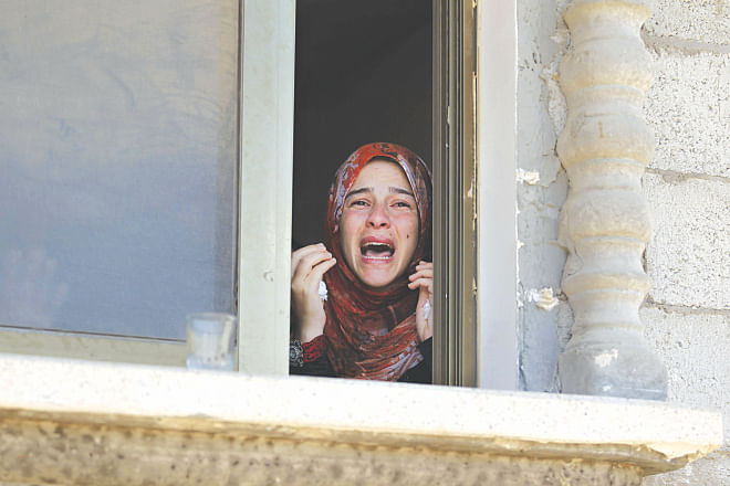 A Palestinian relative mourns during the funeral of four members of the Moamer family after they were killed in an Israeli air strike in southern Gaza Strip city of Rafah yesterday. Photo: AFP