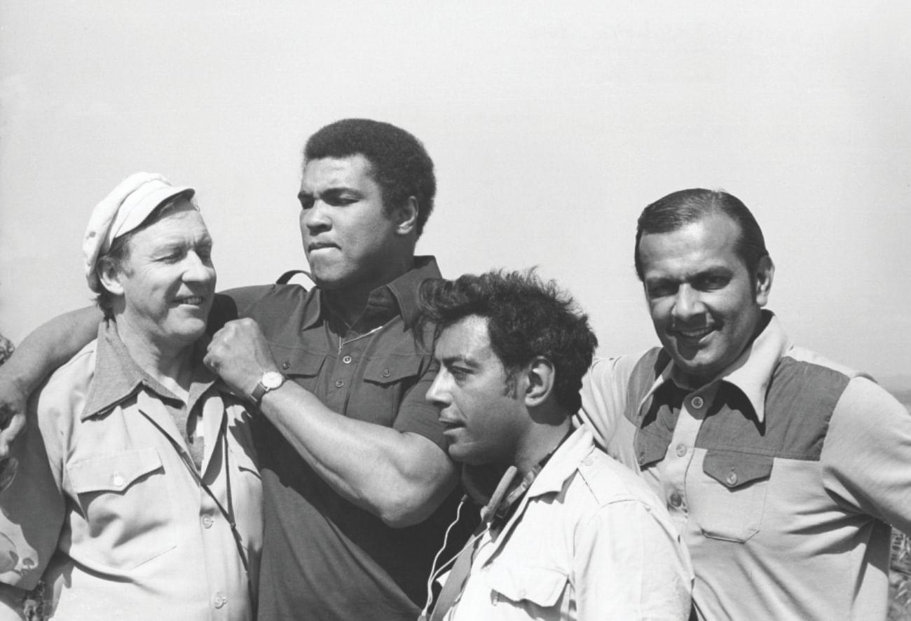 During a break from filming, Ali threatens chief cameraman Rory MacLeod. On the right is Reginald Massey, and in front is chief sound recordist Eric Chohan.  PHOTOS: STAR/REGINALD MASSEY