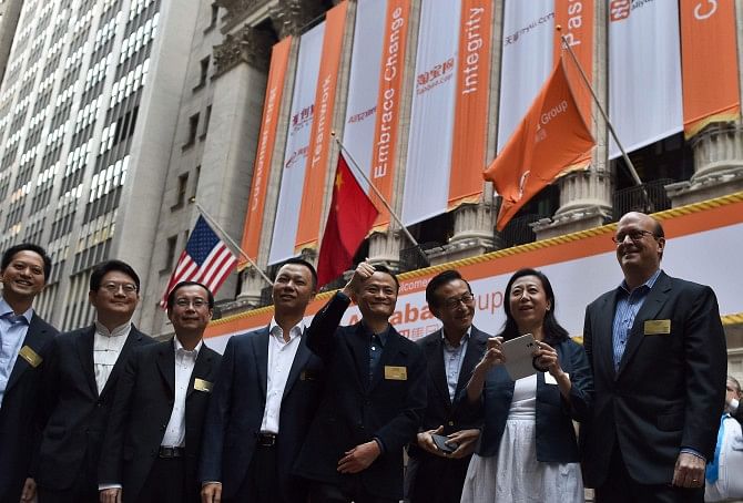 Alibaba CEO Jack Ma, centre, and his company's other executives arrive at the New York Stock Exchange in New York on Friday.  Photo: AFP