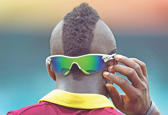 Guess Who? It's West Indies Andre Russell with his new mohawk. PHOTO: AFP