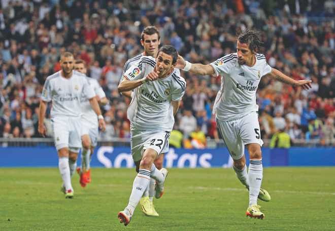 Real Madrid's Angel Di Maria (C) celebrates his goal against Almeria at the Santiago Bernabeu on Saturday. Photo: Reuters